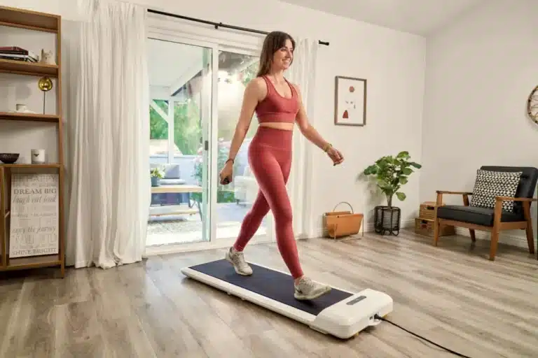 Woman walking on the KingSmith WalkingPad C2 in a living room